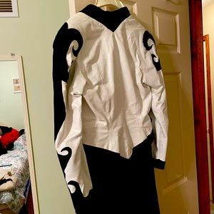 Vinyl and leather look dress. With tassel